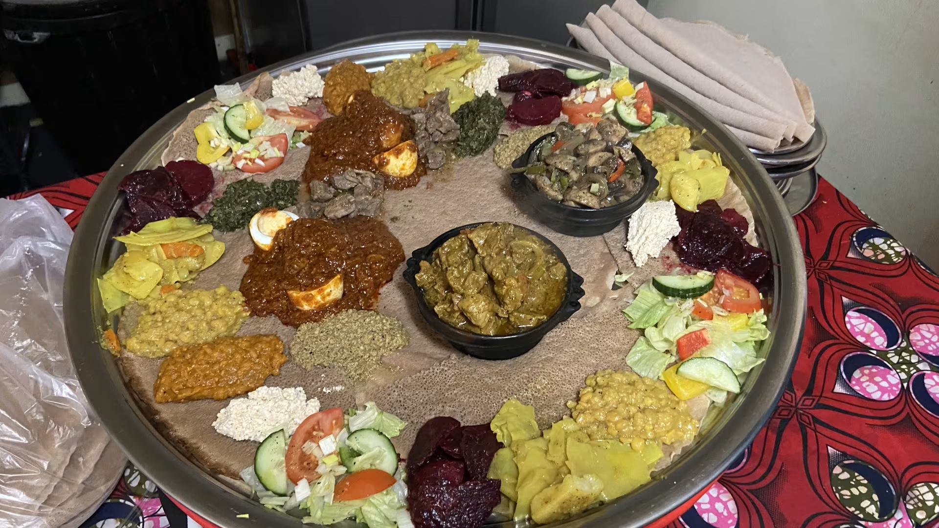 Elaborate Ethiopian feast with multiple traditional dishes
