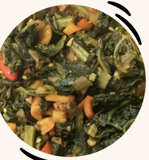 Traditional collard greens stew with carrots and spices