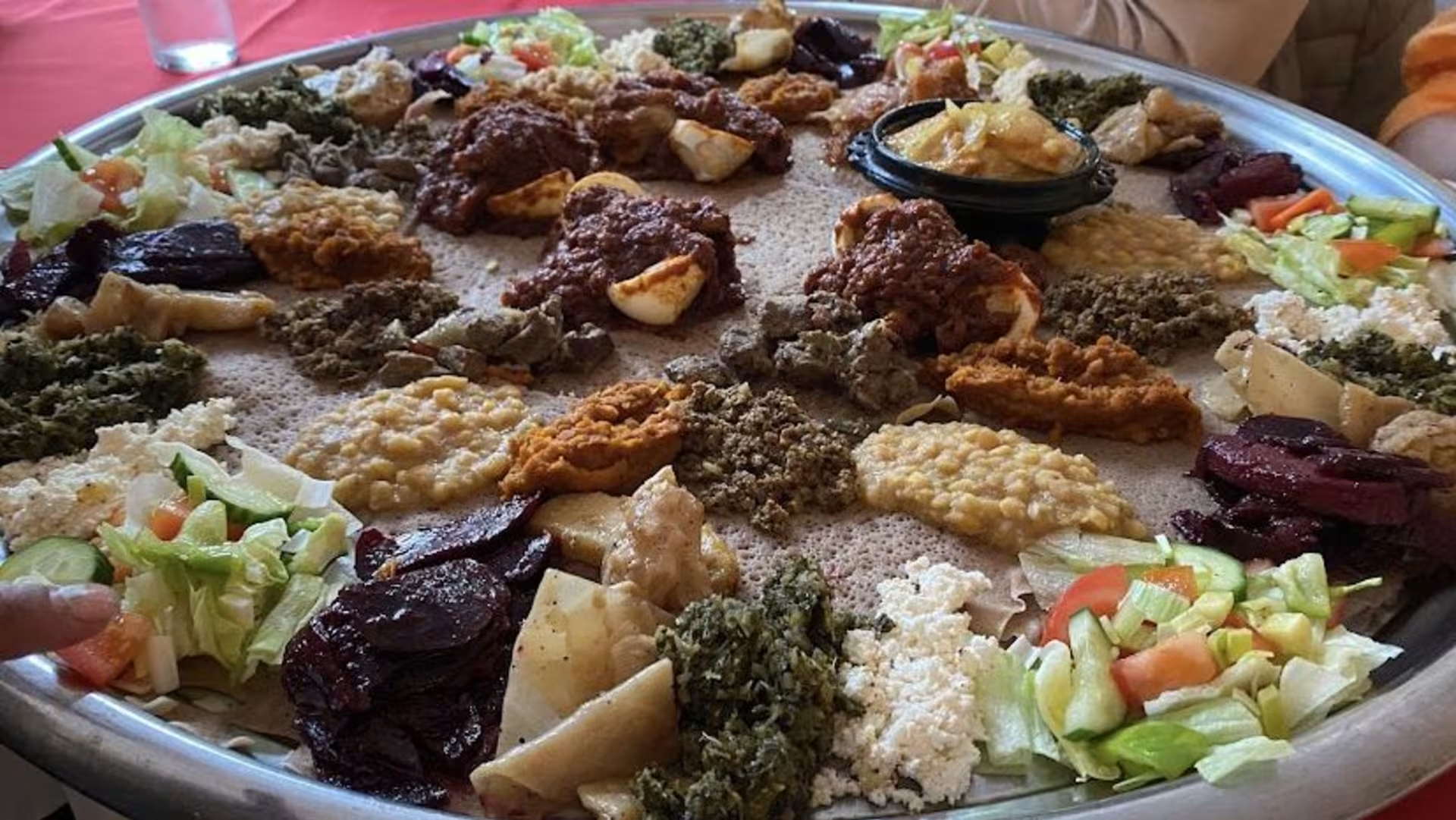 Traditional Ethiopian platter with authentic injera and various stews