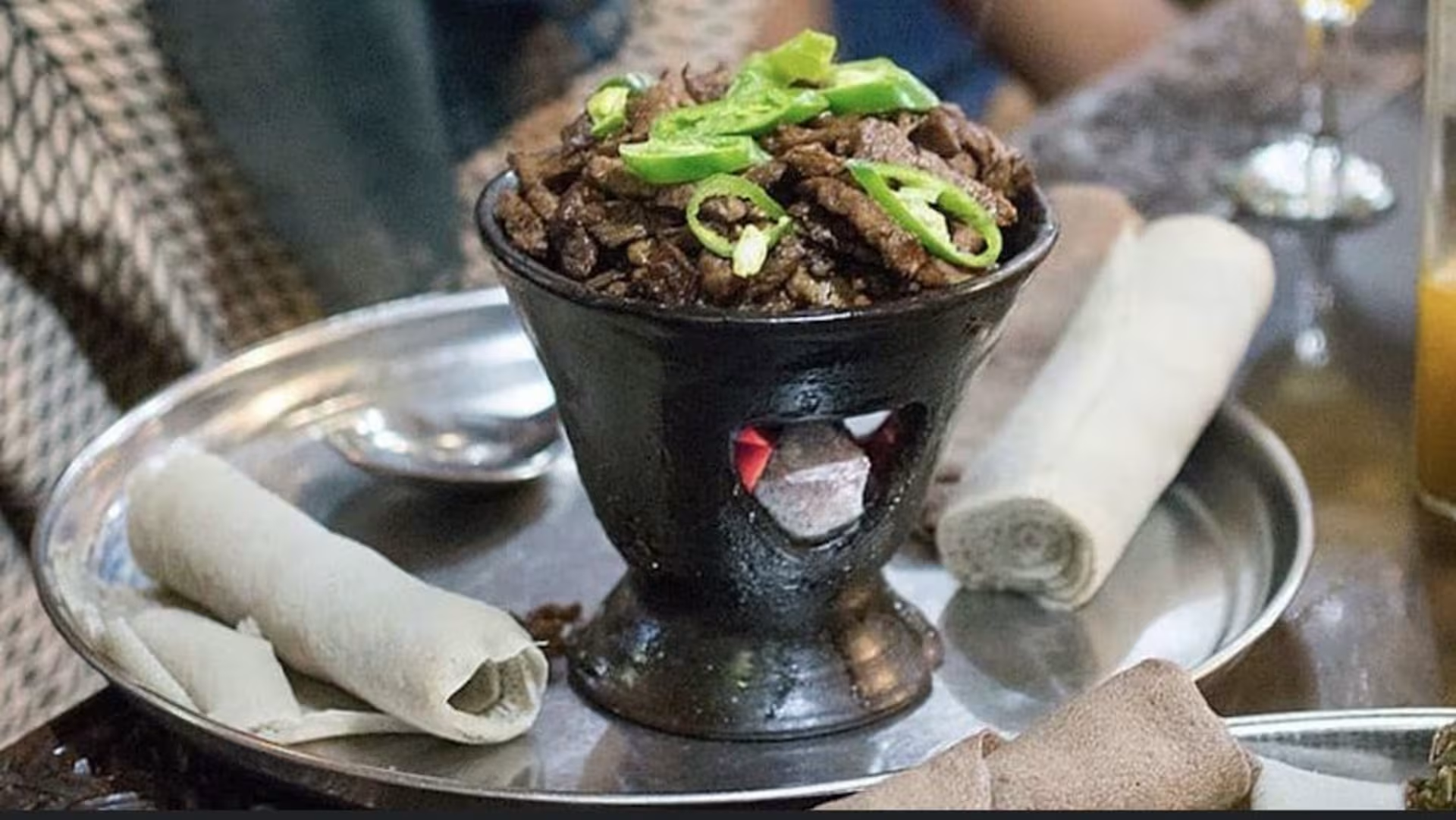 Traditional Ethiopian clay pot with berbere spice preparation
