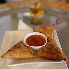 Traditional Ethiopian sambusas served with authentic dipping sauce